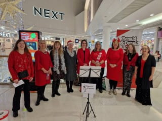 Group from Dynamic Meladies getting ready to perform at Braehead Shopping Centre at Christmas